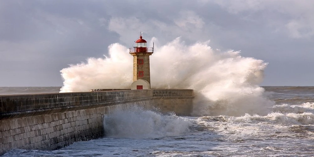 Wayne Hunt - Stormy Waves Over Light house