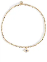 14K Gold Beaded Bracelet With Tiny 14K Gold Diamond Bezel Evil Eye Charm