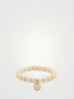 Coral Beaded Bracelet With 14K Gold Peace Sign Charm