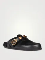 Roman Stud Leather And Shearling Flat Mules