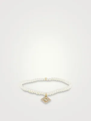 Pearl Bracelet With Large 14K Gold Diamond Evil Eye Charm