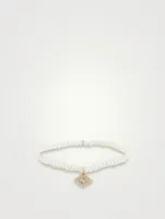 Pearl Bracelet With Large 14K Gold Diamond Evil Eye Charm