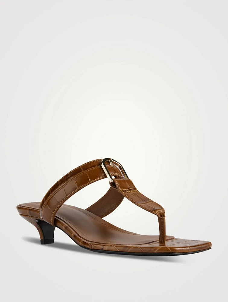 The Belted Croc-Embossed Leather Thong Mules