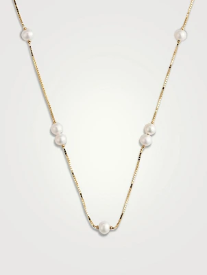 Collier en or 14 carats avec perles flottantes