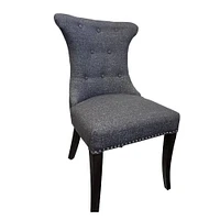 Soma Dining Chair made of tufted fabric upholstered and sleek wood legs