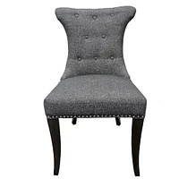 Soma Dining Chair made of tufted fabric upholstered and sleek wood legs