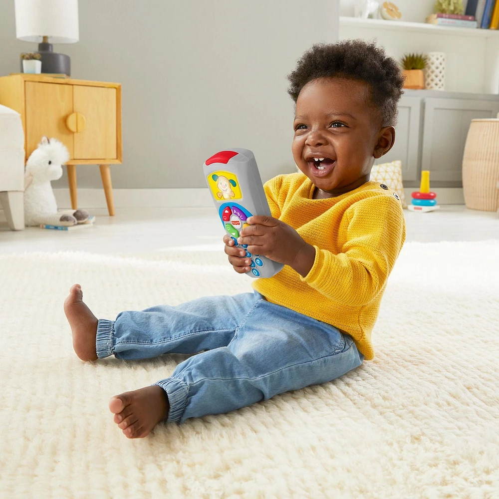 Fisher-Price Laugh & Learn Puppy’s Remote Baby & Toddler Learning Toy with Music & Lights - English Edition