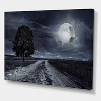 Designart Paved Road Under A Full Moon Canvas Wall Art