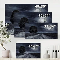 Designart Paved Road Under A Full Moon Canvas Wall Art