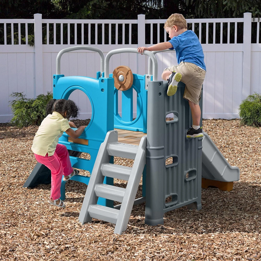 Step2 Scout & Slide Climber Toddler Playset Toddler Play Gym with Elevated Kids Playhouse, Kids Slide, Two Climbing Walls, Steering Wheel, and Metal Bars Dimensions 72.5in x 70in x 55.75in