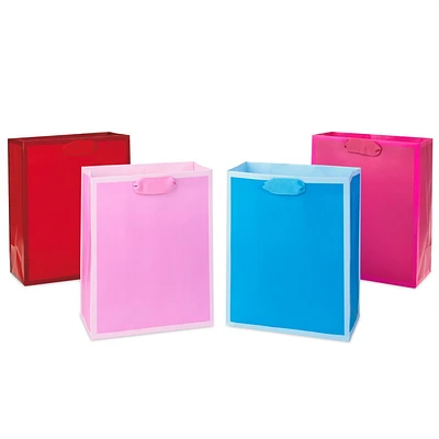 Hallmark 9" Medium Solid Colour Gift Bags - Pack of 4 in Red, Blue, Light Pink and Hot Pink for Birthdays, Baby Showers, Retirements or Any Occasion