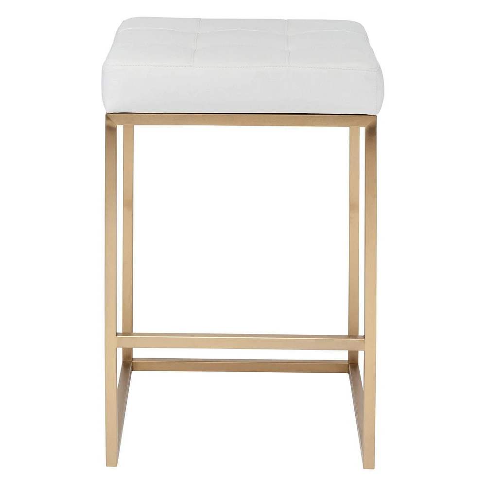 PIPE II COUNTER STOOL with tufted cushion and brushed gold stainless steel frame.