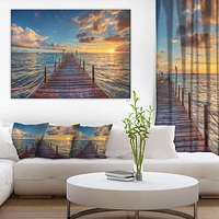 Designart Lever de soleil brillant sur la jetée de la mer Art mural sur toile