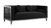 Canapé K-Living Darlene en velours noir avec détails en acier inoxydable chromé sur les côtés des a