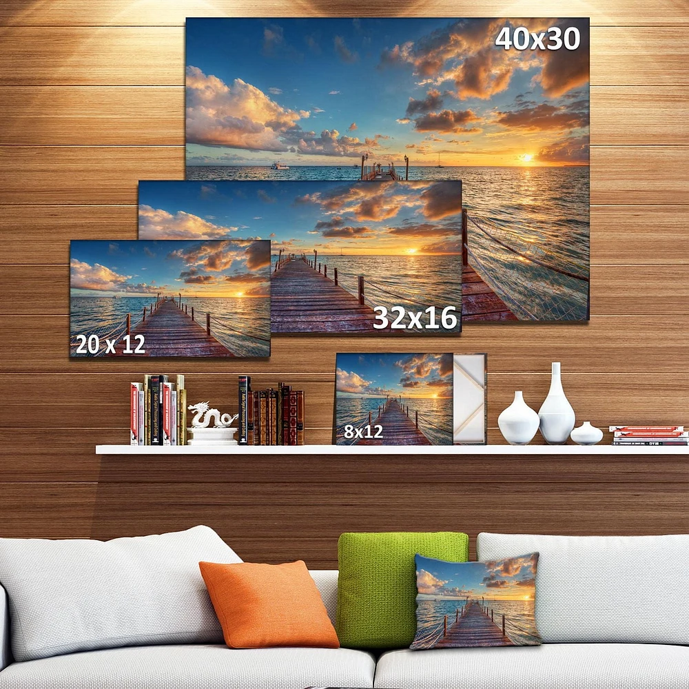 Designart Lever de soleil brillant sur la jetée de la mer Art mural sur toile
