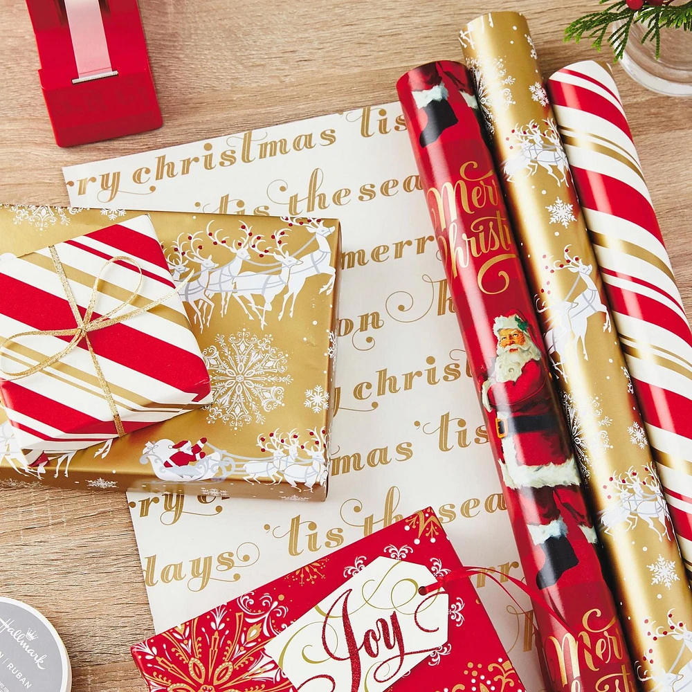 Papier d'emballage réversible de Noël, Hallmark, père Noël classique (Paquet de 3 rouleaux : 120 pieds carrés au total) flocons de neige rouges et or, rayures, motif écossais, traîneau du père Noël