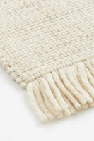 Tapis frangé en laine mélangée