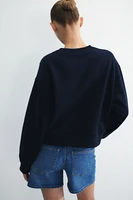 Button-Detail Sweatshirt