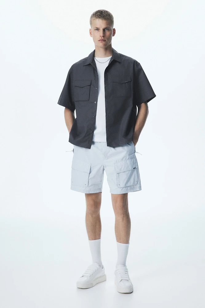Chemise utilitaire à manches courtes coupe ample