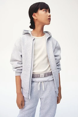 Veste grande taille à glissière avec capuchon