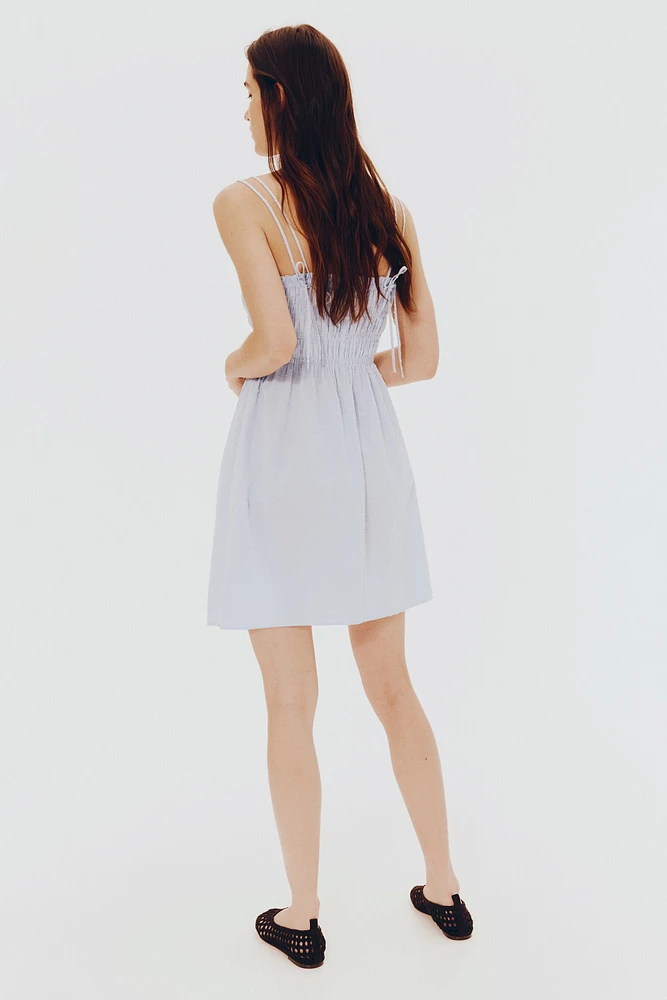 Robe en coton à corsage nid d'abeille