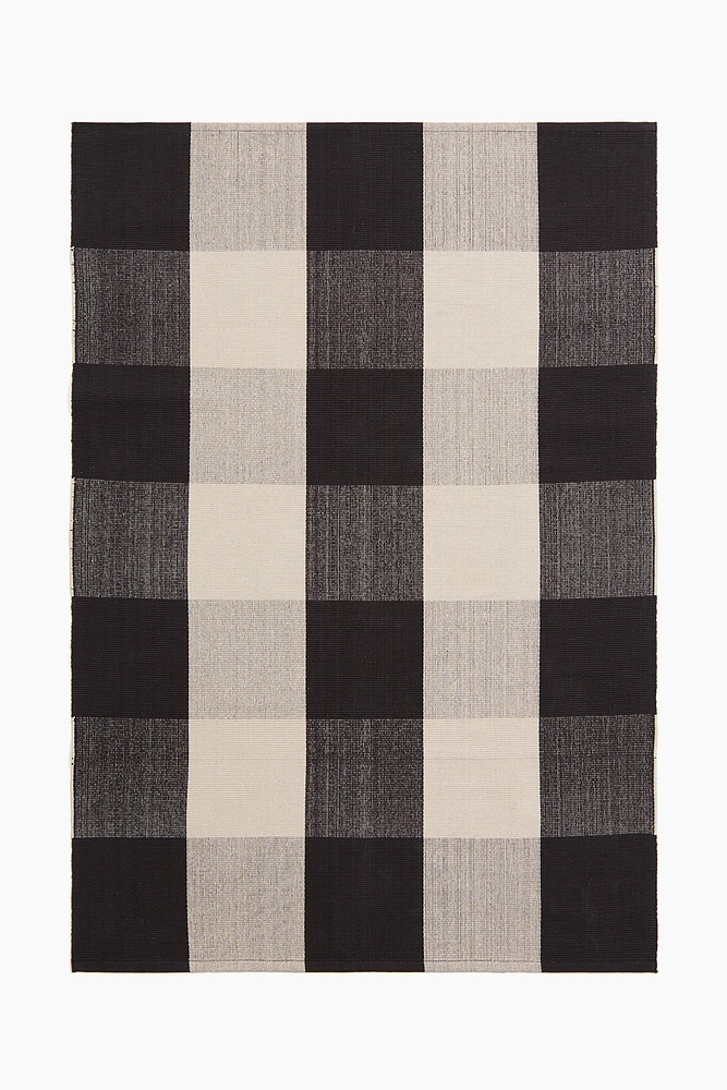 Tapis tissé à plat avec décor à carreaux