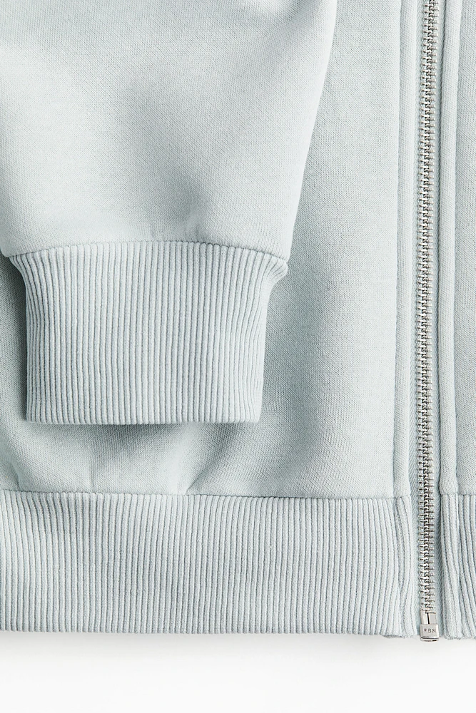 Veste courte avec capuchon et glissière