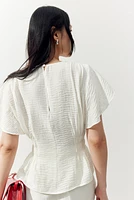 Blouse en tissu texturé