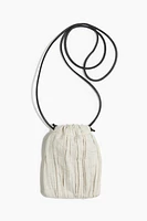 Linen-blend drawstring phone bag