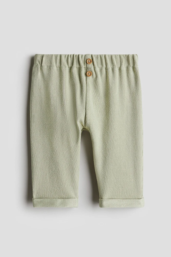 Pantalon à boutons