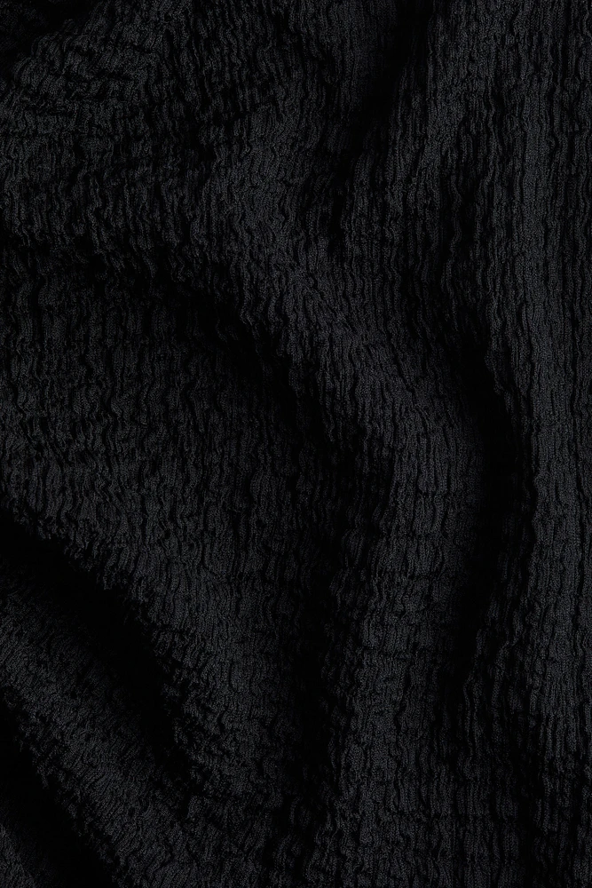 Robe moulante à effet drapé