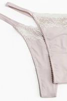 Lot de 2 culottes Tanga en microfibre et dentelle