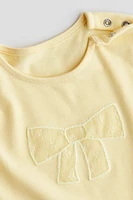 Haut en coton avec appliqués