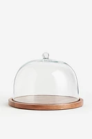 Cloche en verre avec plateau en bois