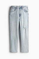 Jean taille haute à la cheville et près du corps