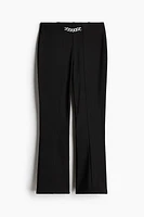 Pantalon évasé avec chaîne