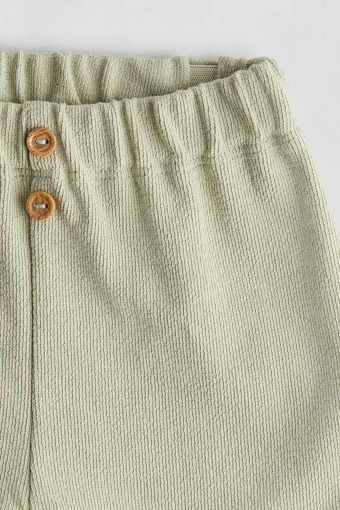Pantalon à boutons