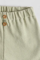 Pantalon à boutons