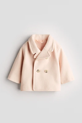 Manteau à fermeture croisée