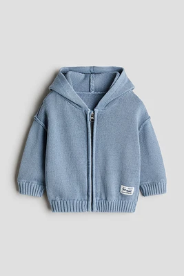 Veste tricot de coton, capuche, fermeture éclair