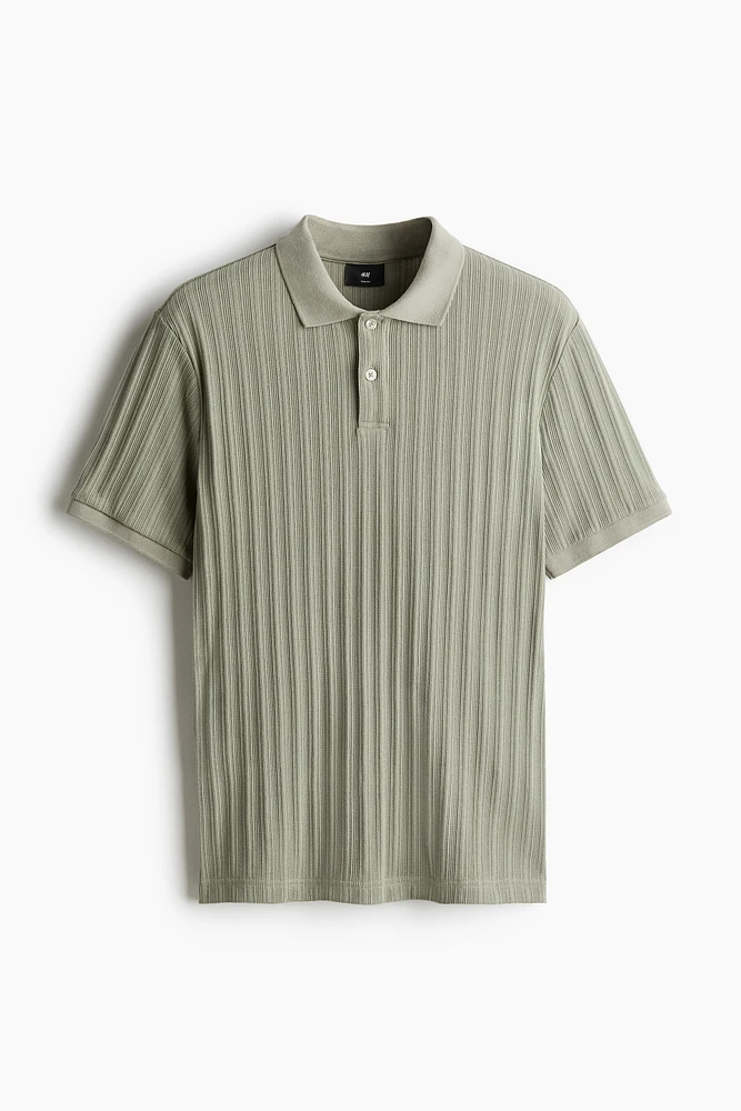 Polo près du corps en jersey texturé