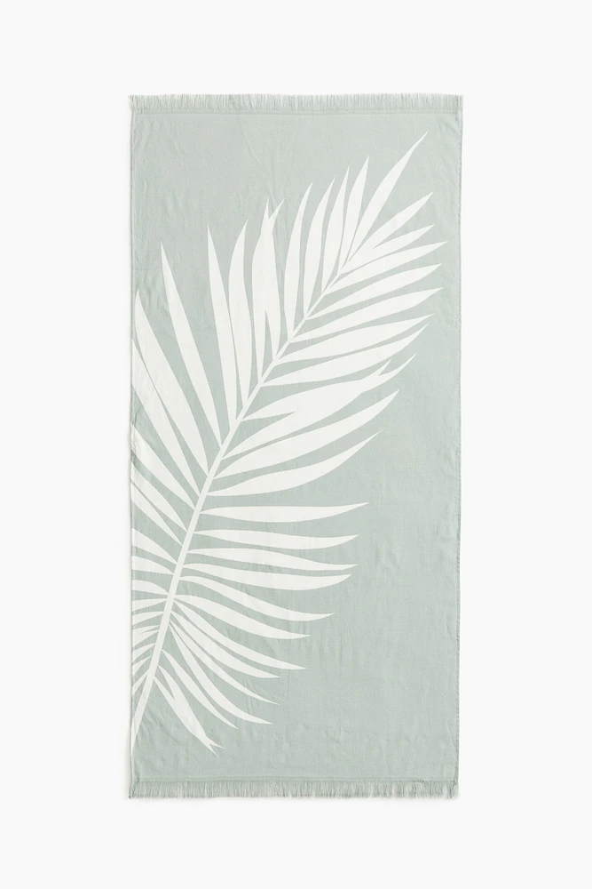 Serviette de plage frangée