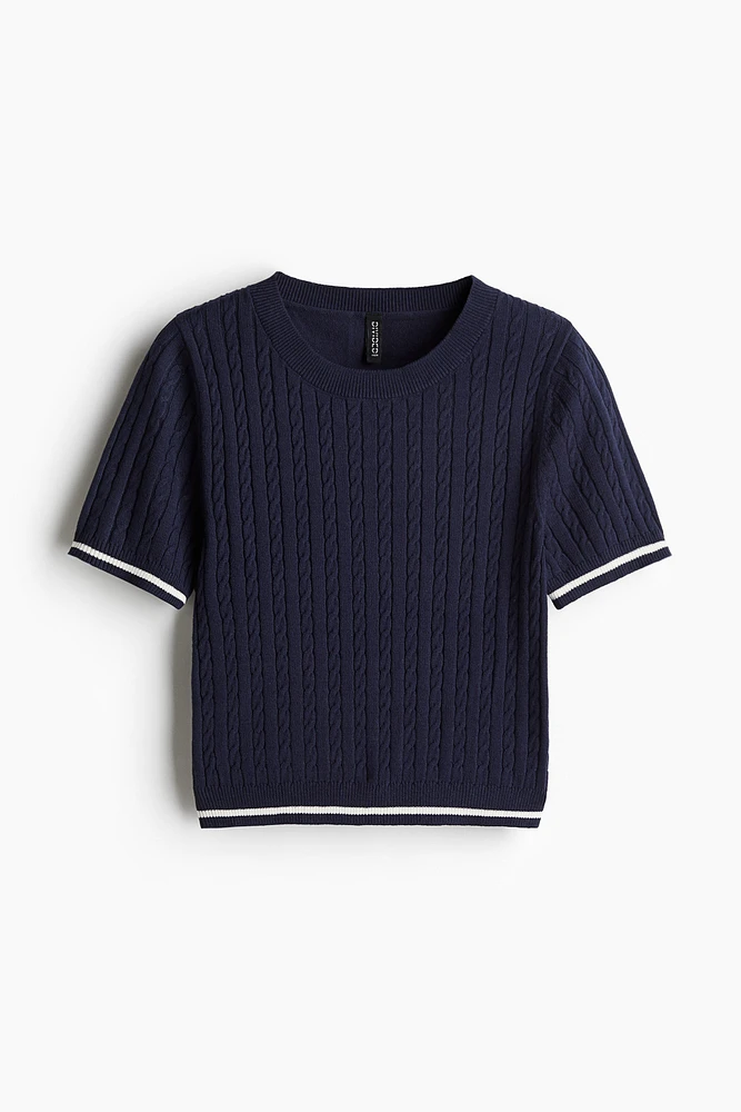 Haut en tricot torsadé