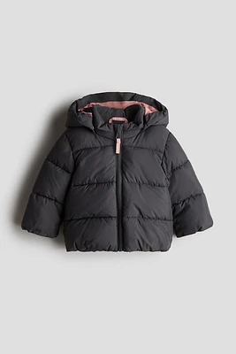 Manteau court matelassé avec appliqués
