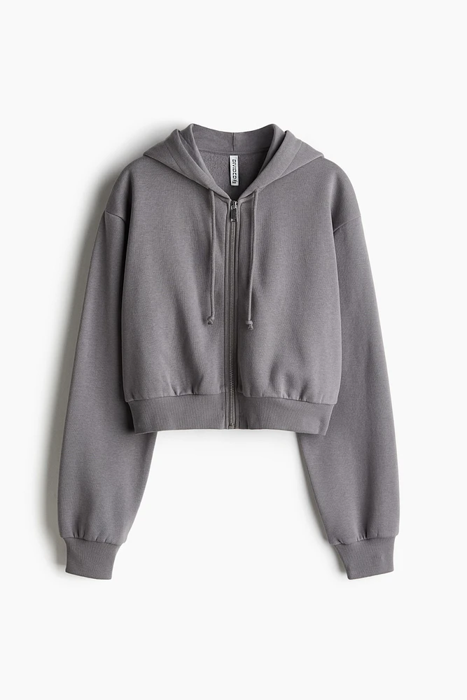 Veste courte avec capuchon et glissière