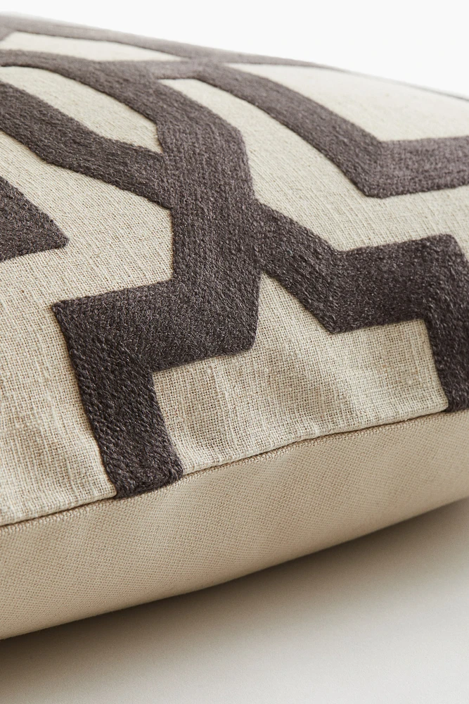 Housse de coussin à motif
