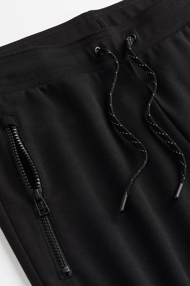 DryMove™ Tapered Tech Joggers with Zipper Pockets