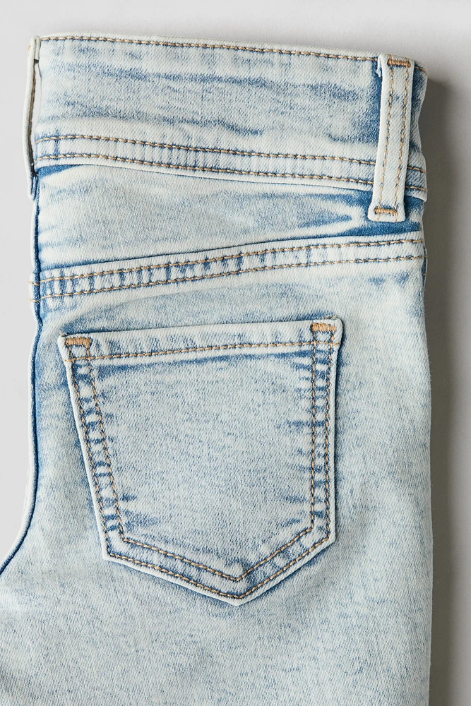 Jean très extensible à jambes évasées