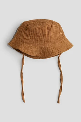 Chapeau en mousseline de coton
