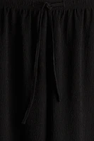 Pantalon en jersey texturé avec cordon de serrage